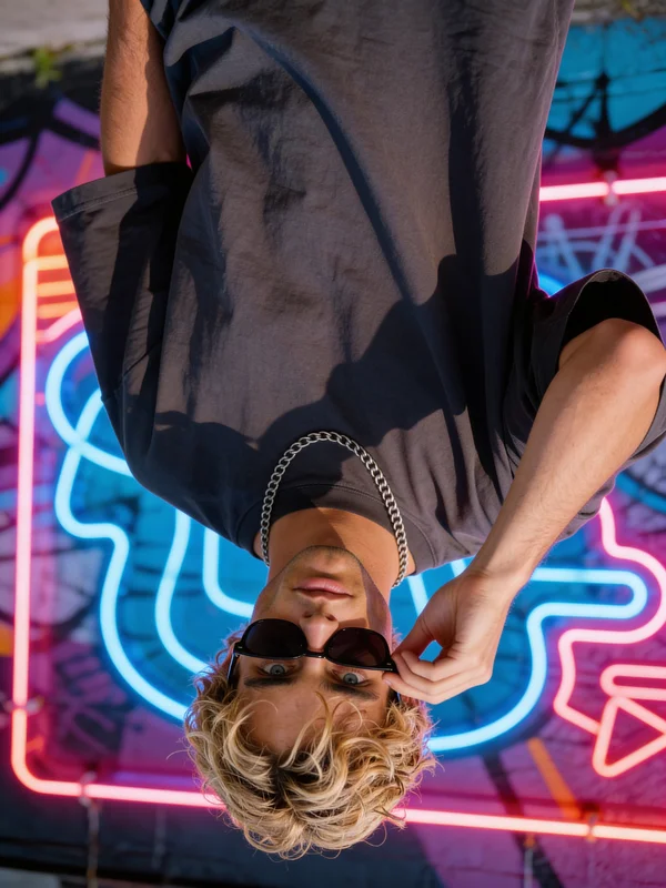 Moody AI male portrait with neon and graffiti